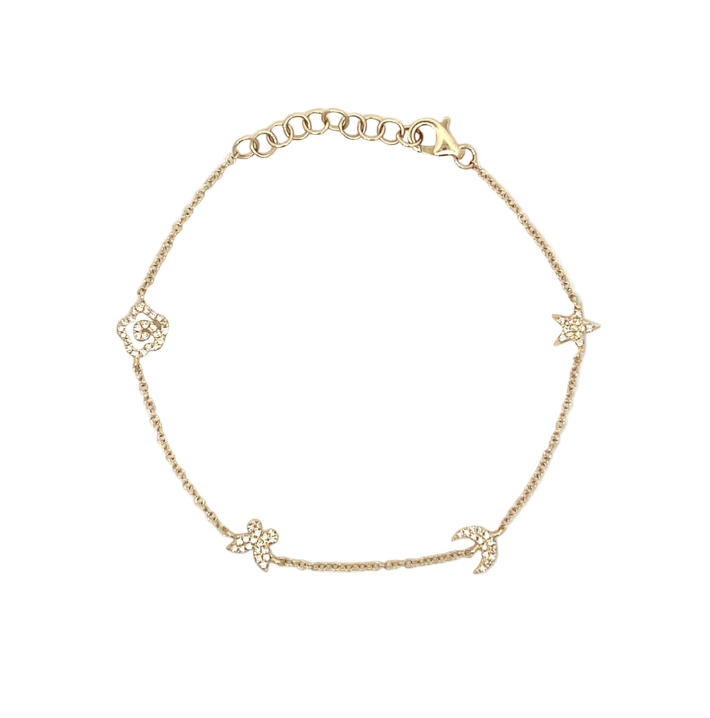 A delicate gold chain bracelet featuring five small celestial charms, including stars, moons, and a flower, laid out on a plain white background.