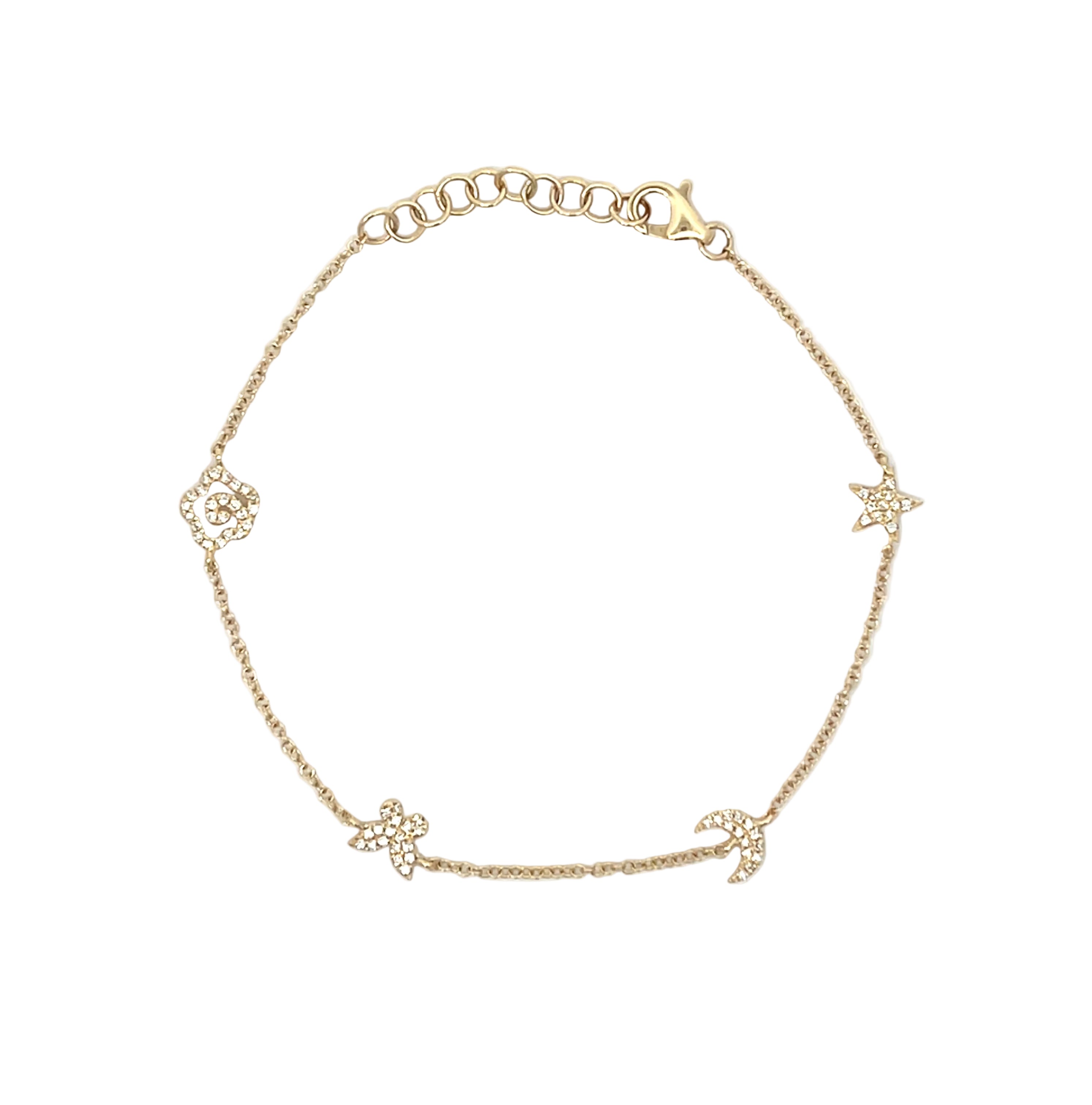 A delicate gold chain bracelet featuring five small celestial charms, including stars, moons, and a flower, laid out on a plain white background.